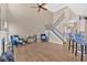 Open living area with fireplace, staircase, and stylish decor at 706 Woodland Pl, Woodstock, GA 30188