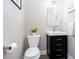 Compact powder room features a modern vanity with sleek fixtures and decor at 1546 Silvaner Nw Ave # 20, Kennesaw, GA 30152