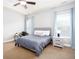 Bedroom with bed, two windows and side table at 1546 Silvaner Nw Ave # 20, Kennesaw, GA 30152