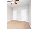 Empty bedroom with a ceiling fan and two doors at 1546 Silvaner Nw Ave # 20, Kennesaw, GA 30152