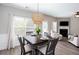 Charming dining area featuring a modern chandelier and an open-concept design at 1546 Silvaner Nw Ave # 20, Kennesaw, GA 30152
