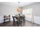 Cozy dining area with a decorative chandelier and bright natural light at 1546 Silvaner Nw Ave # 20, Kennesaw, GA 30152