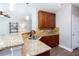 Open kitchen with granite counters, stone backsplash, and a view to the living area at 1546 Silvaner Nw Ave # 20, Kennesaw, GA 30152