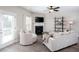Comfortable living room boasts natural light, modern furnishings, and a fireplace at 1546 Silvaner Nw Ave # 20, Kennesaw, GA 30152
