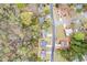 Aerial view shows the property's location, neighborhood, and proximity to wooded areas at 300 Radner Run, Lawrenceville, GA 30043