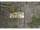 Aerial plat overview of property highlighting lot lines, address, and wooded surroundings at 300 Radner Run, Lawrenceville, GA 30043