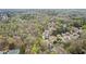 Aerial view of a residential area with lush greenery and well-maintained homes at 300 Radner Run, Lawrenceville, GA 30043