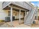 Spacious backyard under deck has brick pavers, stairs to upper deck, and basement access at 300 Radner Run, Lawrenceville, GA 30043