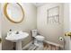 Half bath with pedestal sink and wood floors at 300 Radner Run, Lawrenceville, GA 30043