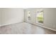 Bright bedroom featuring fresh paint, modern floors, and large windows at 300 Radner Run, Lawrenceville, GA 30043