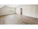 Large bonus room with laminate flooring and bright window at 300 Radner Run, Lawrenceville, GA 30043
