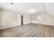 Empty bonus room featuring laminate flooring and white walls at 300 Radner Run, Lawrenceville, GA 30043
