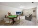 Bonus room staged with game table and entertainment space at 300 Radner Run, Lawrenceville, GA 30043