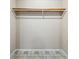A simple closet space with a single shelf and rod, offering storage solutions at 300 Radner Run, Lawrenceville, GA 30043