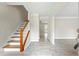 Bright home entryway featuring hardwood floors and staircase at 300 Radner Run, Lawrenceville, GA 30043