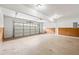 Spacious two-car garage with an automatic door and concrete flooring at 300 Radner Run, Lawrenceville, GA 30043