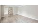 Spacious living room featuring modern floors, fresh paint, and a staircase at 300 Radner Run, Lawrenceville, GA 30043
