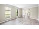 Bright living room with hardwood floors and large windows at 300 Radner Run, Lawrenceville, GA 30043