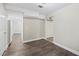 An open living space boasts new floors, neutral walls, and access to the kitchen and other rooms in the home at 300 Radner Run, Lawrenceville, GA 30043