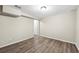 This living space boasts new floors, neutral walls, and access to other rooms in the home at 300 Radner Run, Lawrenceville, GA 30043