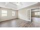 Main bedroom with trey ceiling and carpet floors with open doorway to another room at 300 Radner Run, Lawrenceville, GA 30043