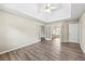 Main bedroom with trey ceiling and carpet floors with open doorway to bathroom at 300 Radner Run, Lawrenceville, GA 30043