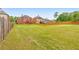 Expansive view of the private backyard showing the fence line and lush green lawn at 3311 Keenland Rd, Marietta, GA 30062
