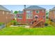 Large backyard with a wooden deck and patio, surrounded by well-maintained landscaping at 3311 Keenland Rd, Marietta, GA 30062