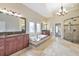 Luxurious bathroom featuring double vanity, tub, and glass shower at 3311 Keenland Rd, Marietta, GA 30062