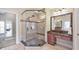 Bright bathroom featuring a glass-enclosed shower with a built-in bench and vanity with granite countertops at 3311 Keenland Rd, Marietta, GA 30062