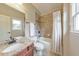 Well-lit bathroom featuring a combination tub and shower and granite vanity at 3311 Keenland Rd, Marietta, GA 30062