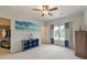 Comfortable bedroom with ample natural light, ceiling fan, and a blue accent wall at 3311 Keenland Rd, Marietta, GA 30062