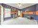 Unique bedroom with large windows and an orange and blue sports theme at 3311 Keenland Rd, Marietta, GA 30062