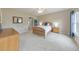 Bright bedroom with neutral walls, carpet, ceiling fan and a window with blue curtains at 3311 Keenland Rd, Marietta, GA 30062