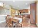 Dining area adjacent to a kitchen, featuring hardwood floors, a staircase, and ample natural light at 3311 Keenland Rd, Marietta, GA 30062