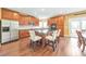 Modern kitchen with stainless steel appliances, an island with seating, and dark wood cabinets, next to the dining area at 3311 Keenland Rd, Marietta, GA 30062