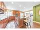 Well-equipped kitchen with dark wood cabinets, a center island with seating, and an open concept design at 3311 Keenland Rd, Marietta, GA 30062