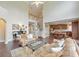 Spacious living room with hardwood floors, fireplace, and open layout leading to the kitchen and dining areas at 3311 Keenland Rd, Marietta, GA 30062