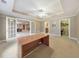 Bright living room featuring french doors, tray ceiling, and access to storage spaces at 3311 Keenland Rd, Marietta, GA 30062