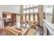 Open-concept living room boasting large windows, hardwood floors, and a cozy seating area near the fireplace at 3311 Keenland Rd, Marietta, GA 30062