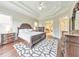Spacious main bedroom featuring a decorative tray ceiling and luxury furniture at 3311 Keenland Rd, Marietta, GA 30062