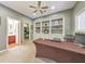 Office with built-in shelving, neutral carpet, and access to an ensuite bathroom at 3311 Keenland Rd, Marietta, GA 30062