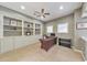 Office with built-in shelving, neutral carpet and lots of natural light from two windows at 3311 Keenland Rd, Marietta, GA 30062