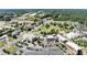 Stunning aerial shot of a lively commercial district with lush green parks and tree-lined streets at 3932 Boston Common St, Suwanee, GA 30024