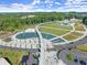 Aerial view of a beautifully landscaped park with water features, walking paths, green spaces, and ample parking at 3932 Boston Common St, Suwanee, GA 30024