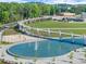 Aerial view featuring pond and walking paths at 3932 Boston Common St, Suwanee, GA 30024