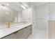 Modern bathroom with a dual sink vanity, gold fixtures, and a large glass shower with patterned tile at 3932 Boston Common St, Suwanee, GA 30024