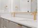 Bathroom featuring double sinks, modern cabinetry, and luxurious gold fixtures at 3932 Boston Common St, Suwanee, GA 30024