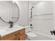Bathroom featuring a wood vanity and modern shower with subway tile at 3932 Boston Common St, Suwanee, GA 30024