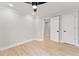 Bright bedroom with hardwood floors, white trim, and doors at 3932 Boston Common St, Suwanee, GA 30024